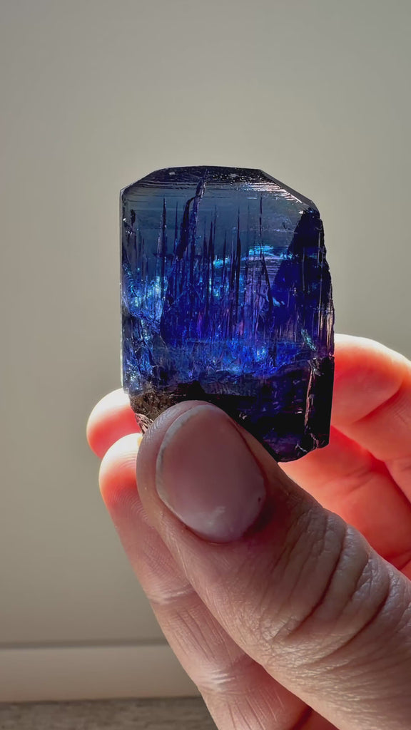 Video showing an unheated gem clean tanzanite crystal specimen with trichroic color shifts
