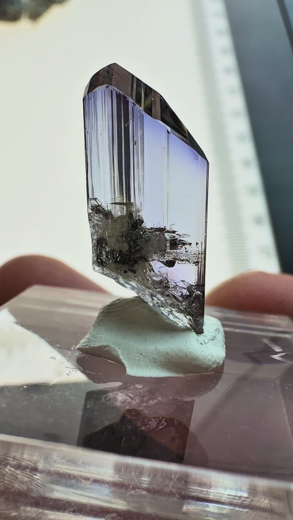 Video showing an unheated gem clean tanzanite crystal specimen with trichroic color shifts