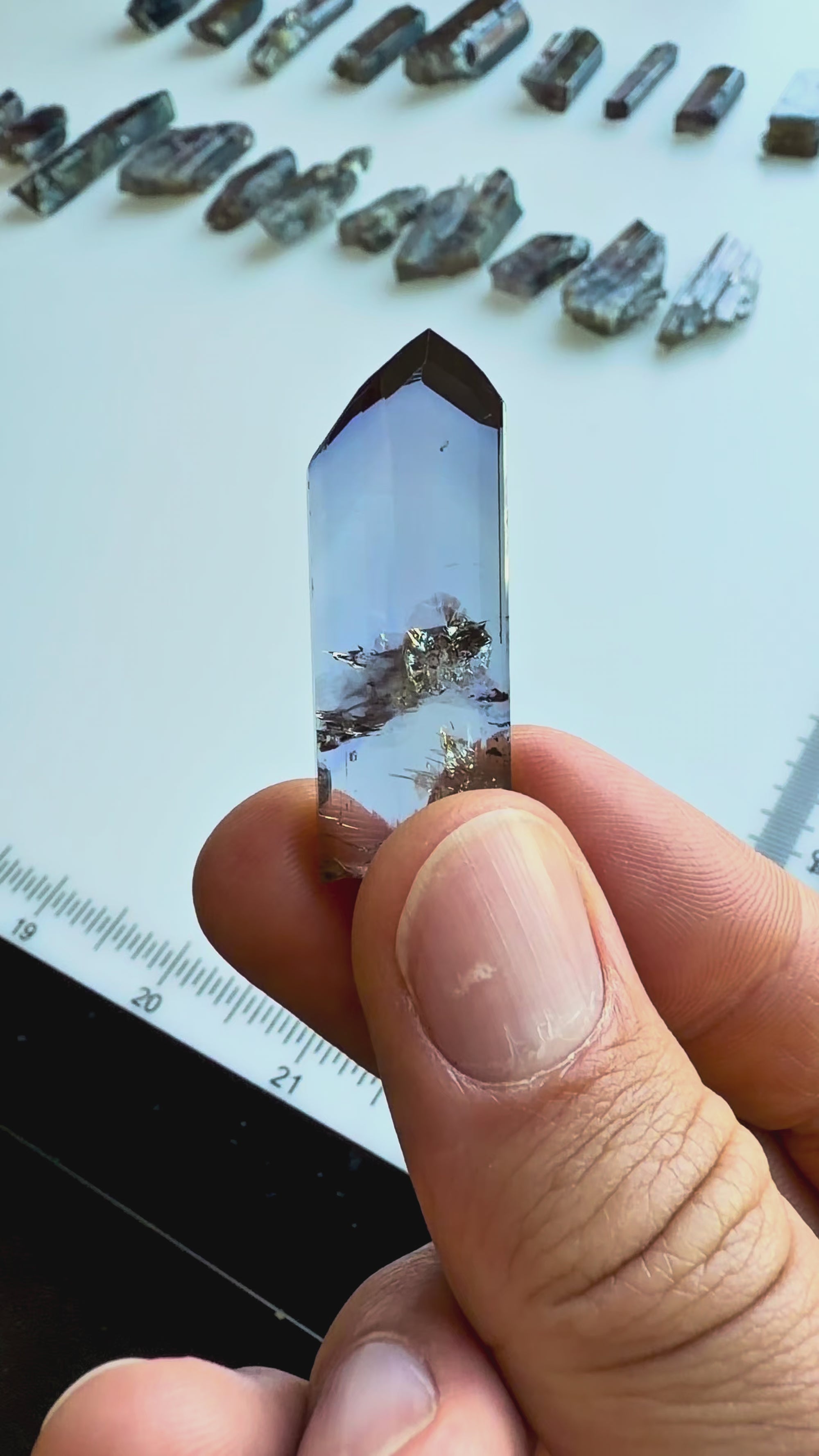 Video showing an unheated gem clean tanzanite crystal specimen with trichroic color shifts