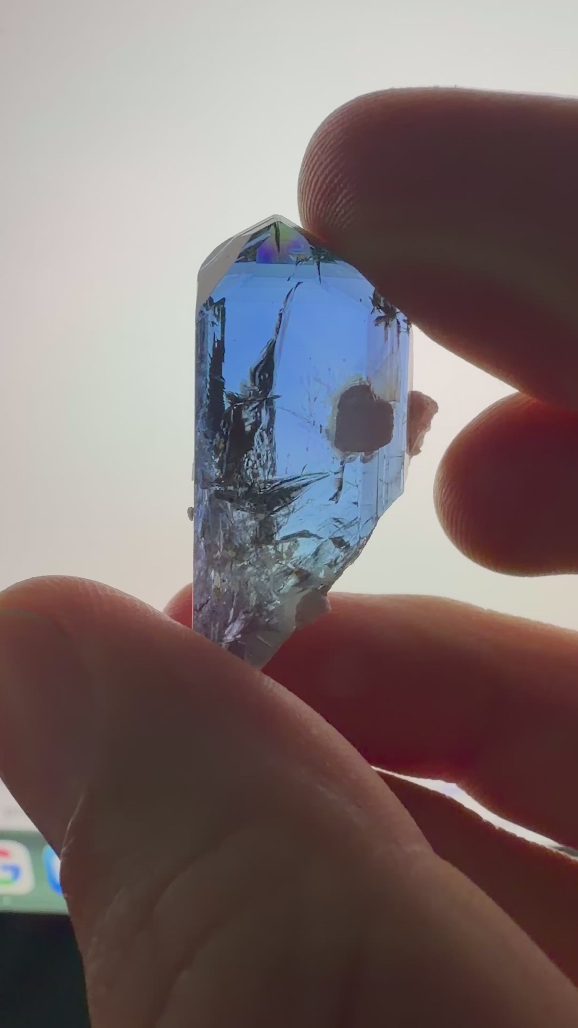Video showing an unheated gem clean tanzanite crystal specimen with trichroic color shifts