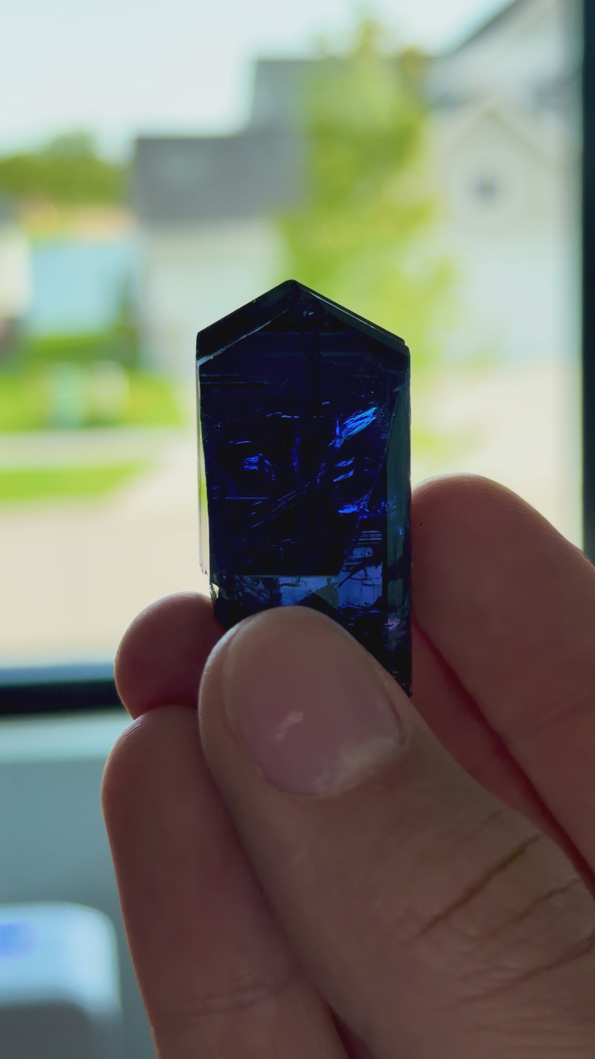 Video showing an unheated gem clean tanzanite crystal specimen with trichroic color shifts